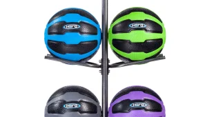 Vertical of 10 hero strength medicine balls in various sizes. Red and black, pink and black, yellow and black, orange and black, blue and black, green and black, purple and black, gray and black