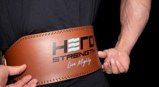 Closeup of a weightlifter adjusting the Hampton Leather Lifting Belt.