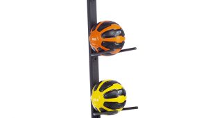 5 remedy balls on a black vertical rack in various colors - pink and black, orange and black, yellow and black, green and black