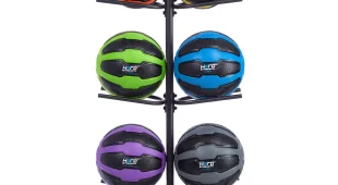 10 remedy balls on a black vertical rack in various colors