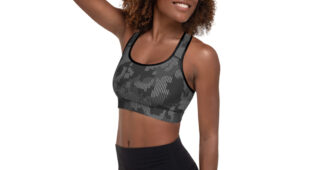 African American woman with short natural hair, side facing camera, shades of gray camo racerback sports bra with black leggings