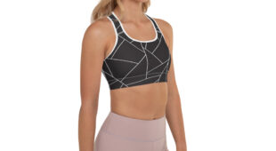 blonde woman, black and white racerback bra with geometric designs, side facing and muted mauve leggings