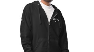 male modeling black zip up hoodie with white hampton logo on the chest