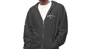 male modeling charcoal zip up hoodie with white hampton logo on the chest