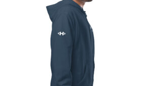 male modeling navy zip up hoodie with white hampton logo on the sleeve